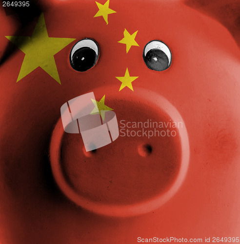 Image of Ceramic piggy bank with painting of national flag 