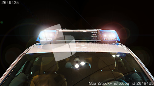 Image of Police car with flash lights and siren