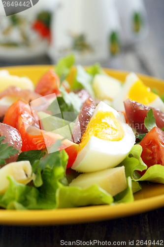 Image of Salad with anchovies, tomatoes and eggs.