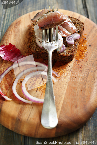 Image of Old fork with anchovies.