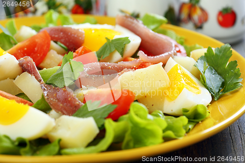 Image of Colorful salad with anchovies.