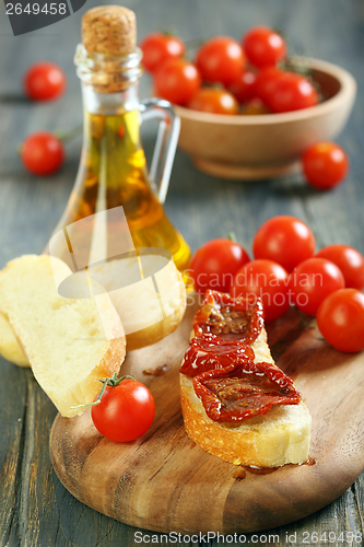 Image of Sun-dried tomatoes on a piece ciabatta.