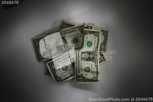 Image of dollars in the dark night 