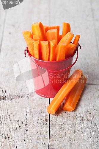 Image of fresh sliced carrot in red bucket 