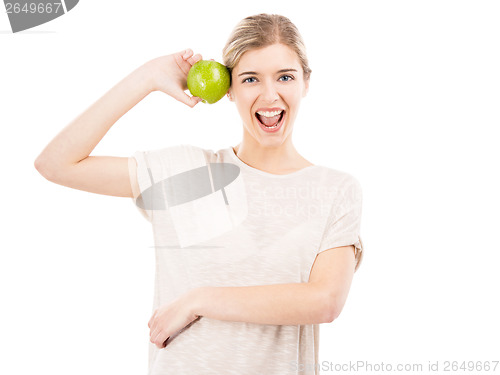 Image of Beautiful woman with a green apple