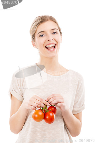 Image of Beaitiful woman holding red tomatos