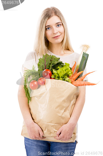 Image of Beautiful woman carrying vegetables