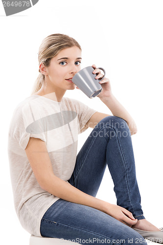 Image of Beautiful woman drinking coffee