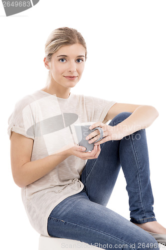 Image of Beautiful woman drinking coffee