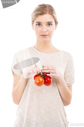 Image of Beaitiful woman holding red tomatos