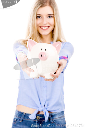 Image of Beautiful woman holding  a piggy bank