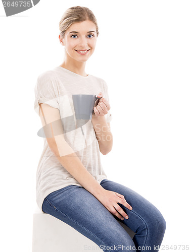 Image of Beautiful woman drinking coffee