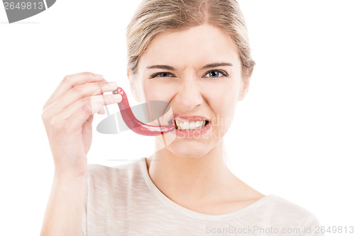 Image of Biting a red chilli pepper