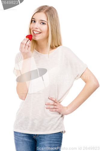 Image of Woman tasting strawberries