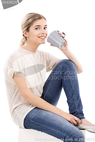 Image of Beautiful woman drinking coffee