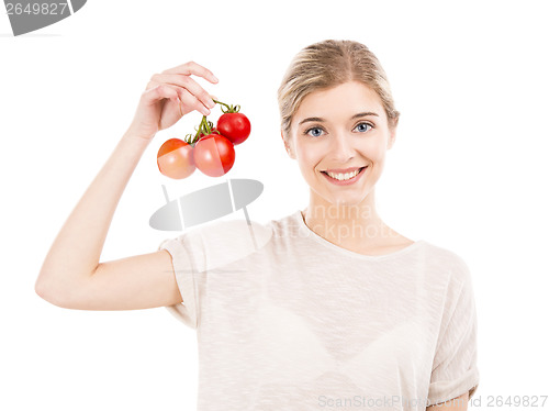 Image of Beaitiful woman holding red tomatos