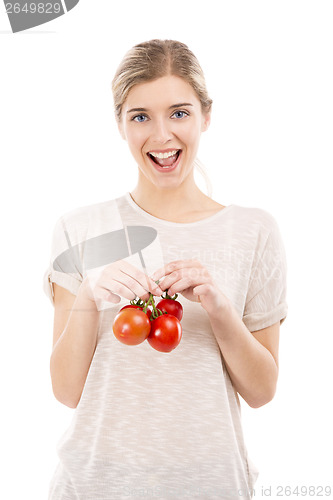 Image of Beaitiful woman holding red tomatos