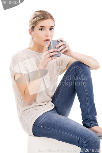 Image of Beautiful woman drinking coffee