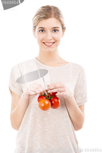 Image of Beaitiful woman holding red tomatos