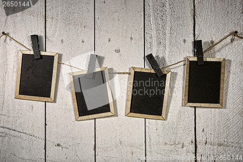 Image of Film Looking Chalkboards Hanging on a Rope Held By Clothespins