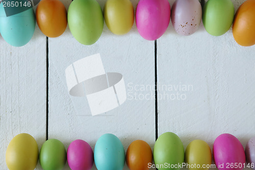 Image of Easter or Spring Themed Background of Old Wood and Colored Eggs 