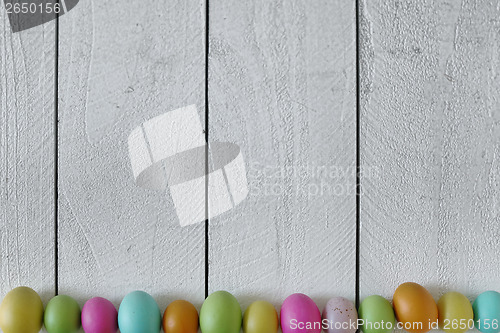 Image of Easter or Spring Themed Background of Old Wood and Colored Eggs 