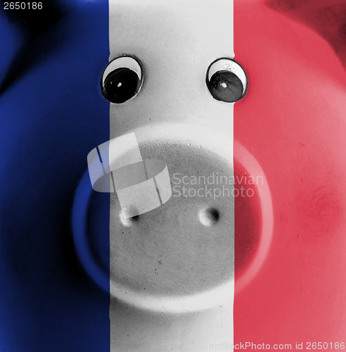 Image of Ceramic piggy bank with painting of national flag 