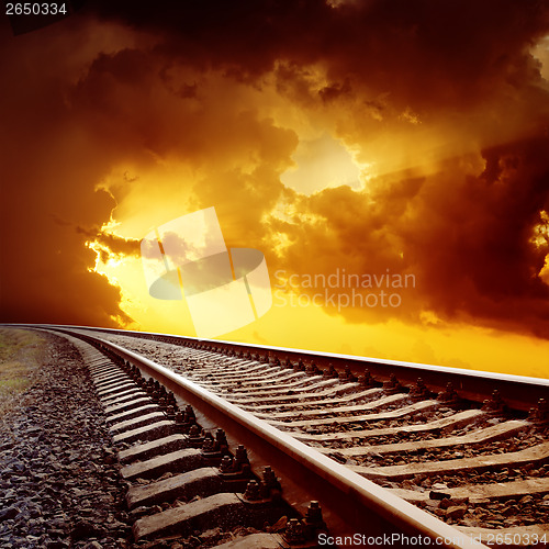 Image of railroad closeup to orange horizon in sunset