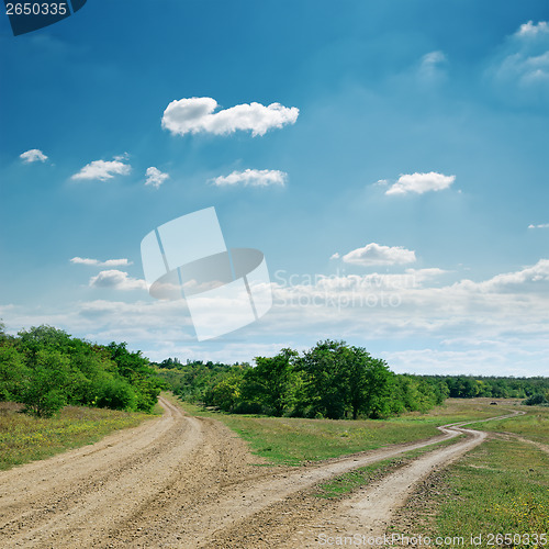 Image of two rural road under cloudy sky