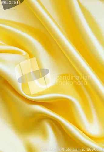 Image of Smooth elegant golden silk as background 