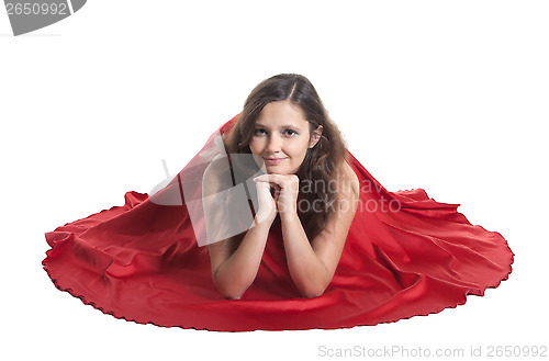 Image of Beautiful woman sitting on the floor