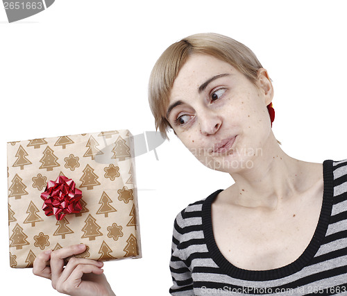 Image of Young woman holding a present