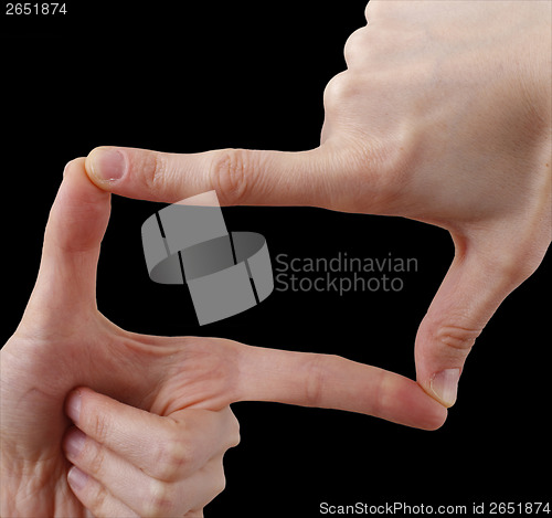 Image of White hand on black