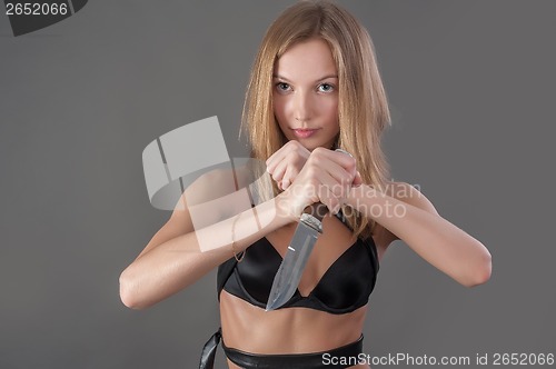 Image of Pretty girl with knife