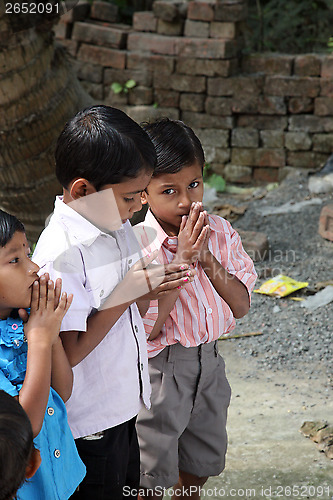 Image of Group of young Bengali Catholics pray before a statue of the Blessed Virgin Mary, Basanti, West Bengal, India