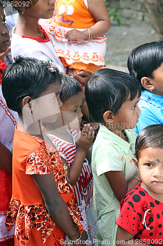 Image of Group of young Bengali Catholics pray before a statue of the Blessed Virgin Mary, Basanti, West Bengal, India