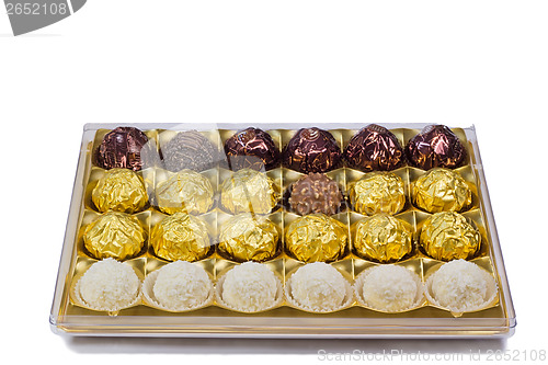 Image of Chocolate sweets in the box on the white background.