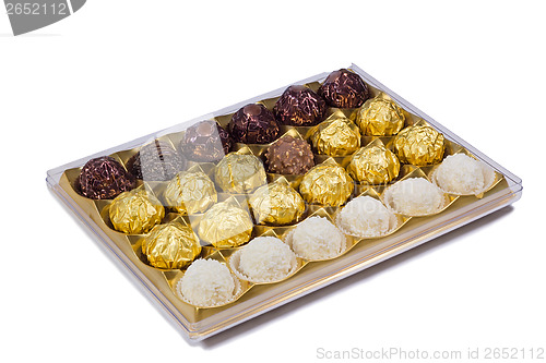 Image of Chocolate sweets in the box on the white background.