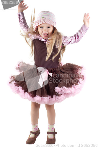 Image of Little girl in studio jumping