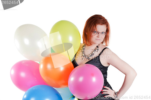 Image of Beautiful woman keeping multicolored air balloons