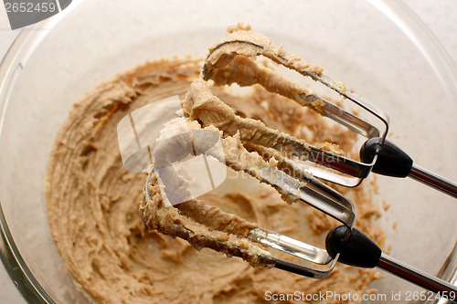 Image of Creaming sugar and butter together with a hand mixer