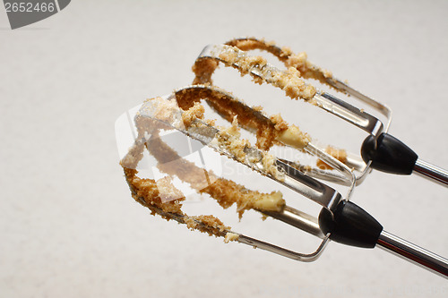 Image of Food mixer beaters covered in butter and sugar