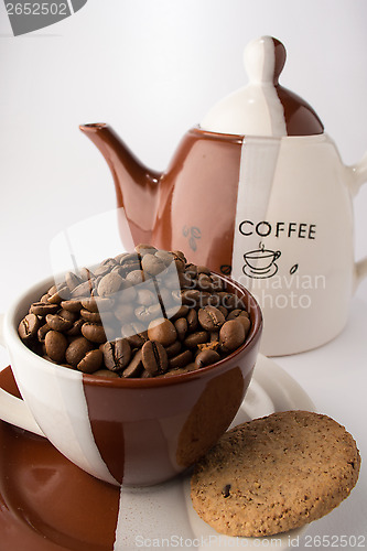 Image of Cup of roasted brown coffee beans