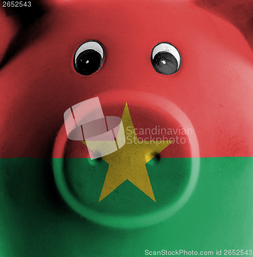 Image of Ceramic piggy bank with painting of national flag 