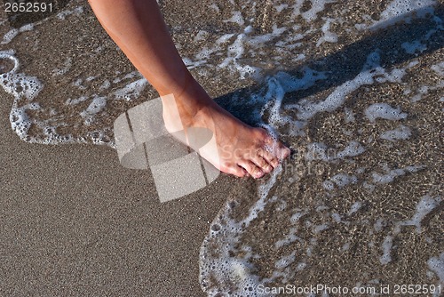 Image of Foot on the sand.