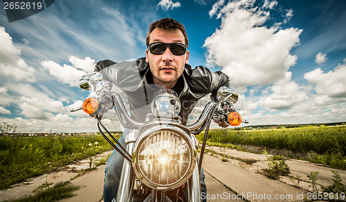 Image of Funny Biker racing on the road