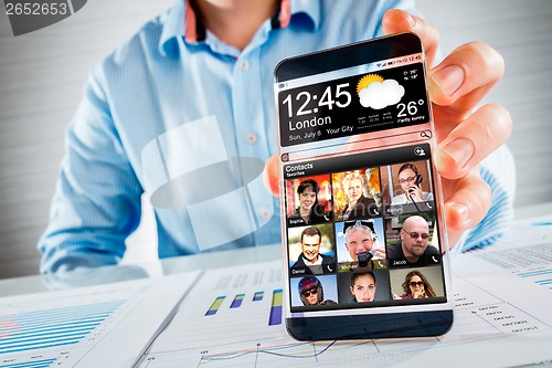 Image of Smartphone with transparent screen in human hands.