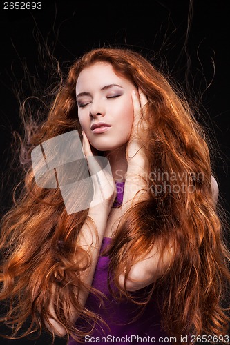 Image of Beautiful woman with red hair