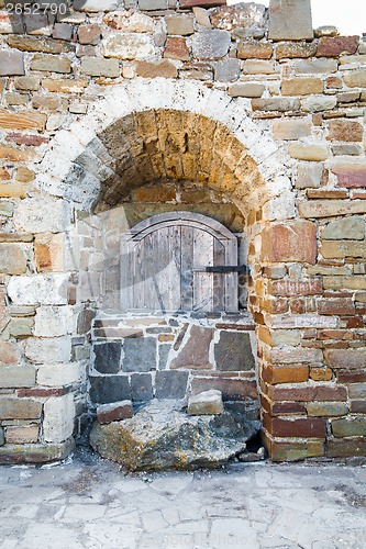 Image of Ancient wooden window of medieval brick wall