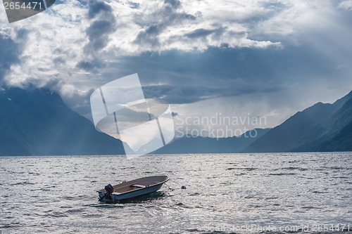 Image of Fishing boat floating on water on fjord